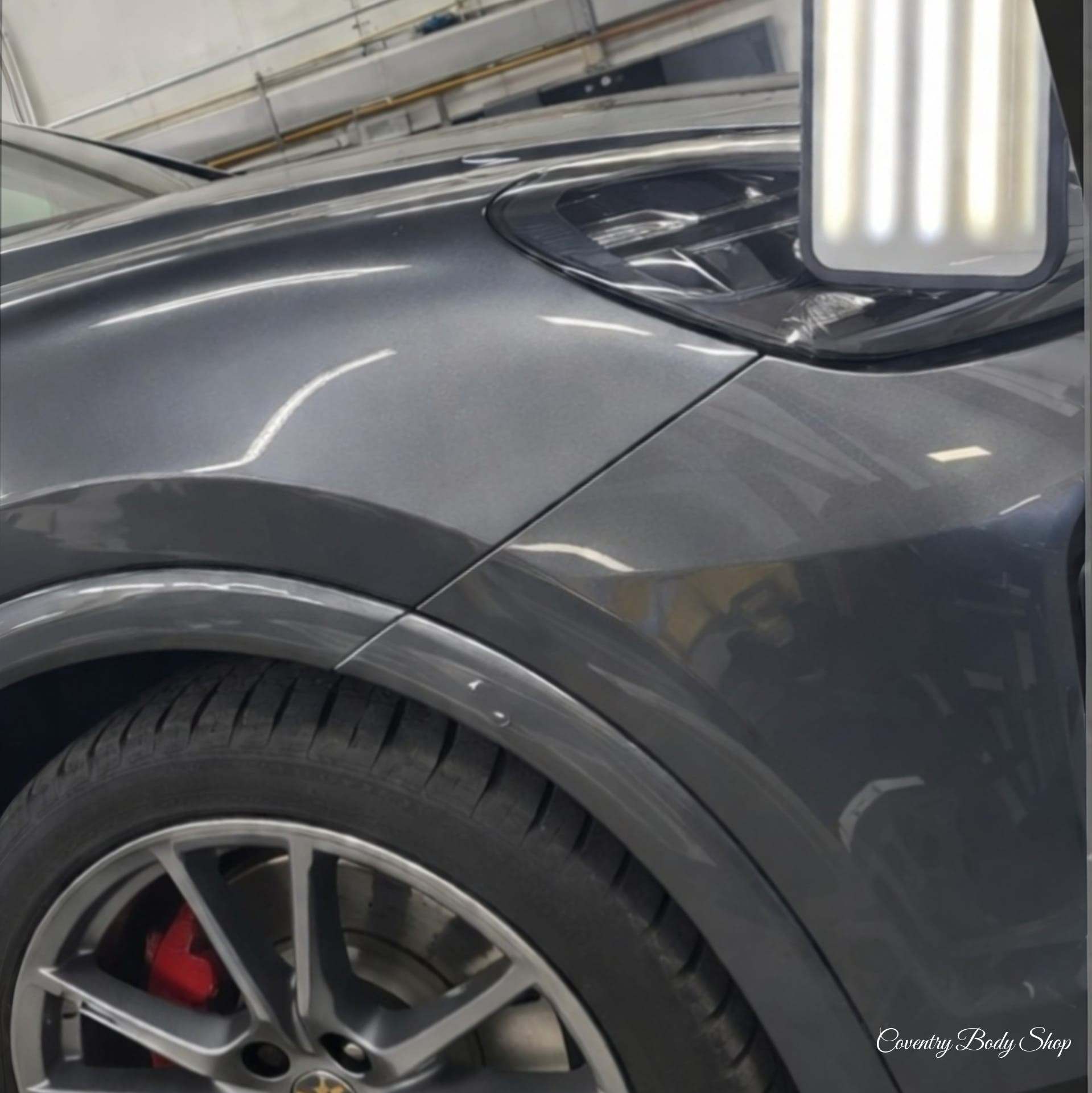 Porsche Cayenne's panel o/s front panel minor dent (after)